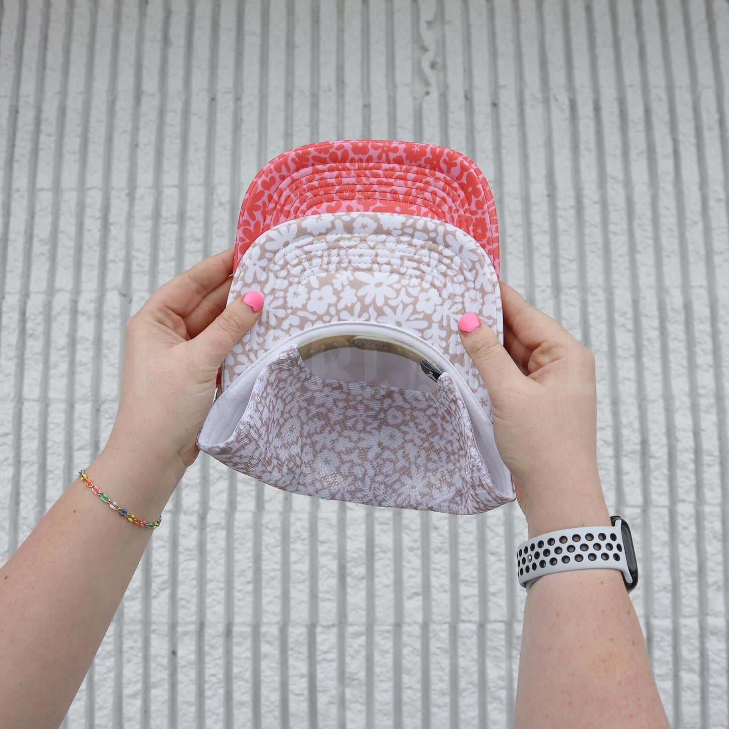 CORAL FLORAL TRUCKER HAT