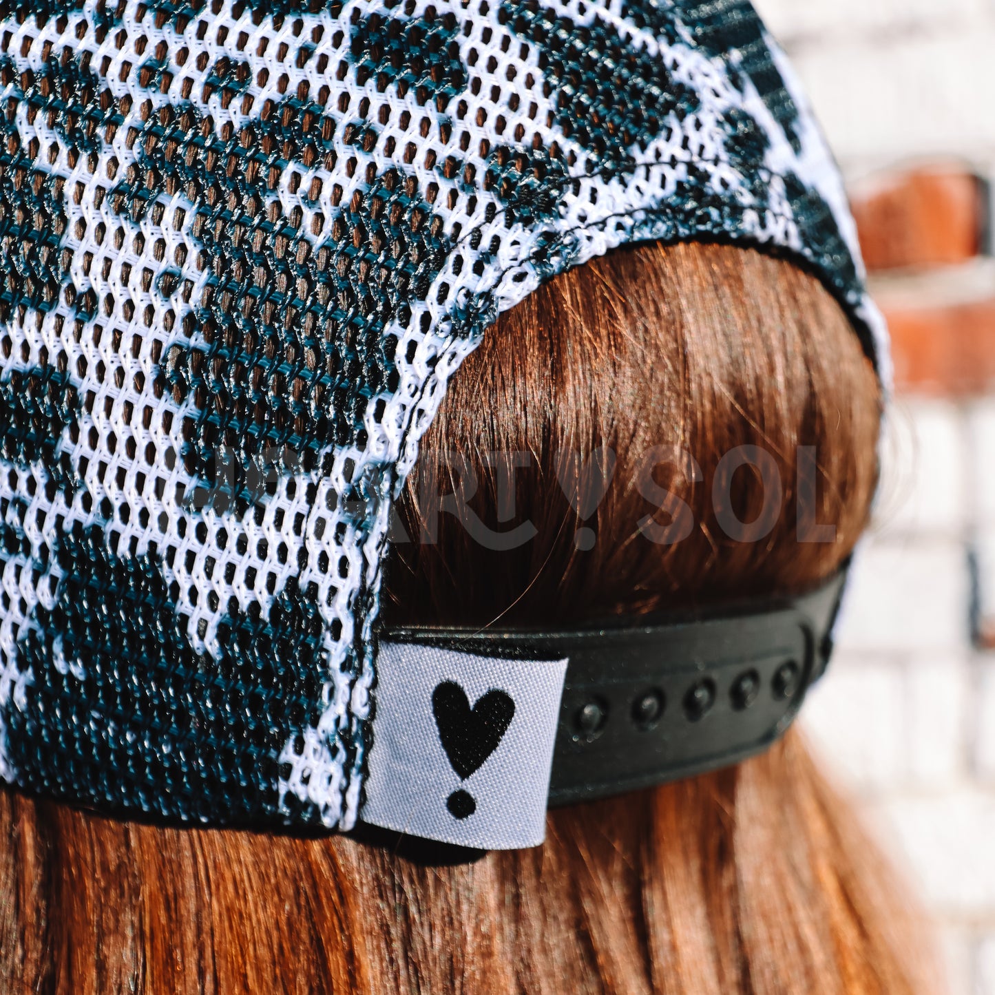 COW PRINT TRUCKER HAT