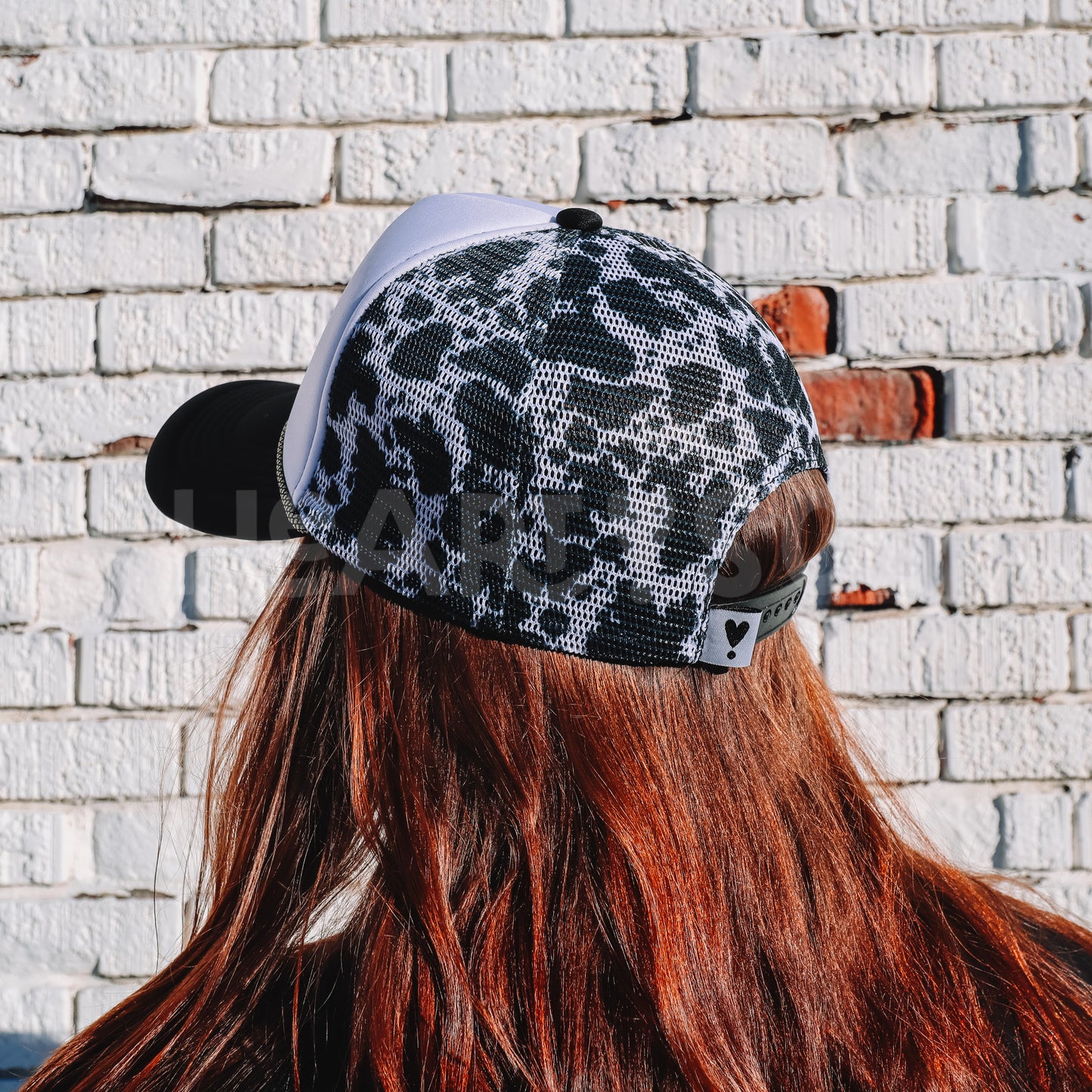 COW PRINT TRUCKER HAT