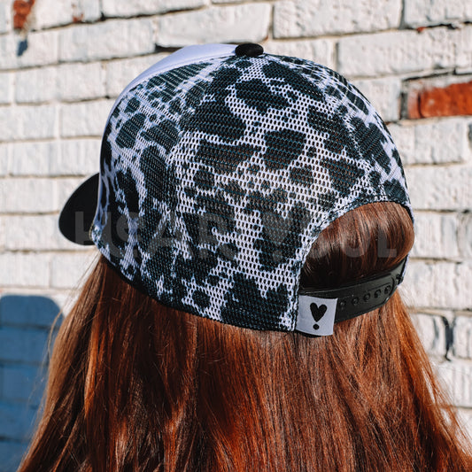 COW PRINT TRUCKER HAT