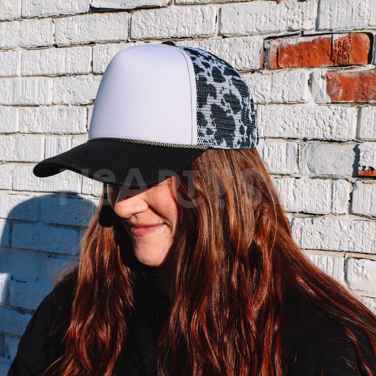 COW PRINT TRUCKER HAT