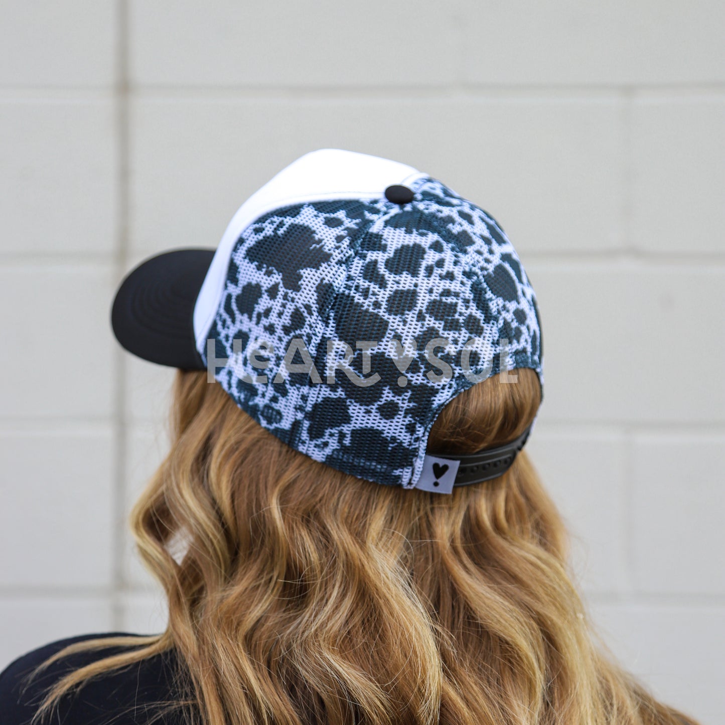 COW PRINT TRUCKER HAT